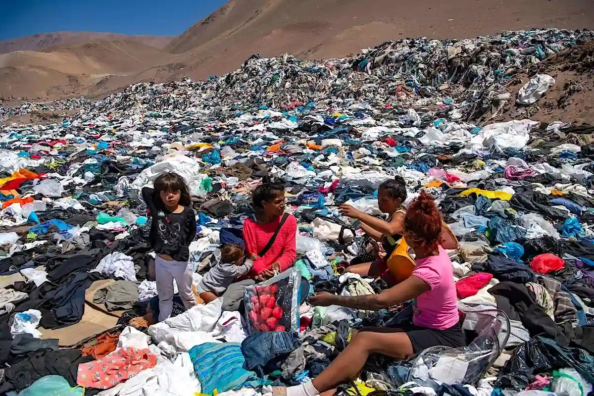 Fashion waste landfill with people